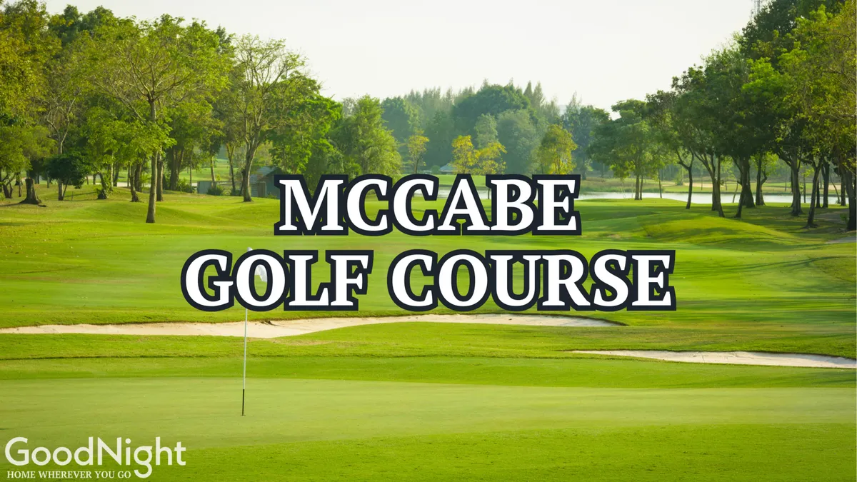 A lush green golf course dotted with trees, with a flag marking the hole, under a peaceful sky. The open space invites recreational activities such as golfing or taking a refreshing walk in nature.